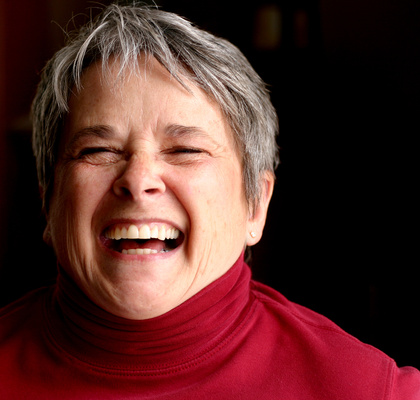 Mature short haired woman laughing